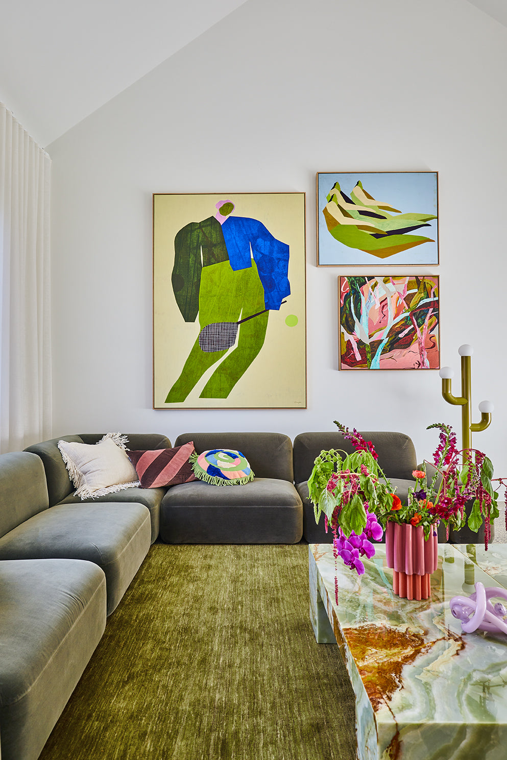 Wallington living room designed by Nikki McGar Interiors featuring large-scale statement artwork, bold colour, and soft neutral furnishings for balance.