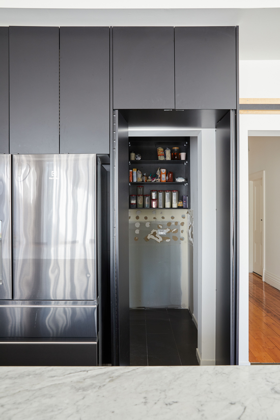 Before: Original Newtown butler’s pantry prior to renovation by Nikki McGar Interiors, with dated finishes and limited storage.
