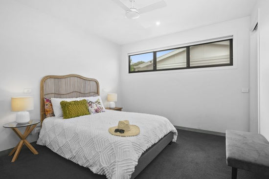 Before: Barwon Heads bedroom prior to renovation by Nikki McGar Interiors, with plain finishes and minimal personality.