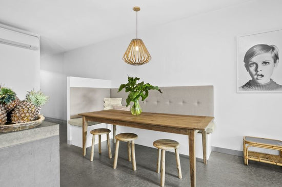 Before: Neutral Barwon Heads dining space prior to renovation by Nikki McGar Interiors, with plain finishes and minimal colour.