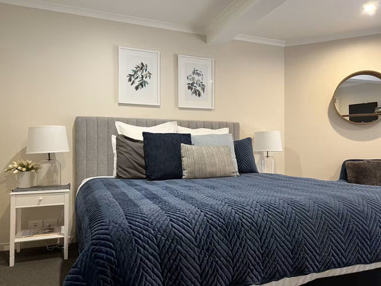 Before: Bedroom prior to renovation by Nikki McGar Interiors, with plain walls and minimal character.